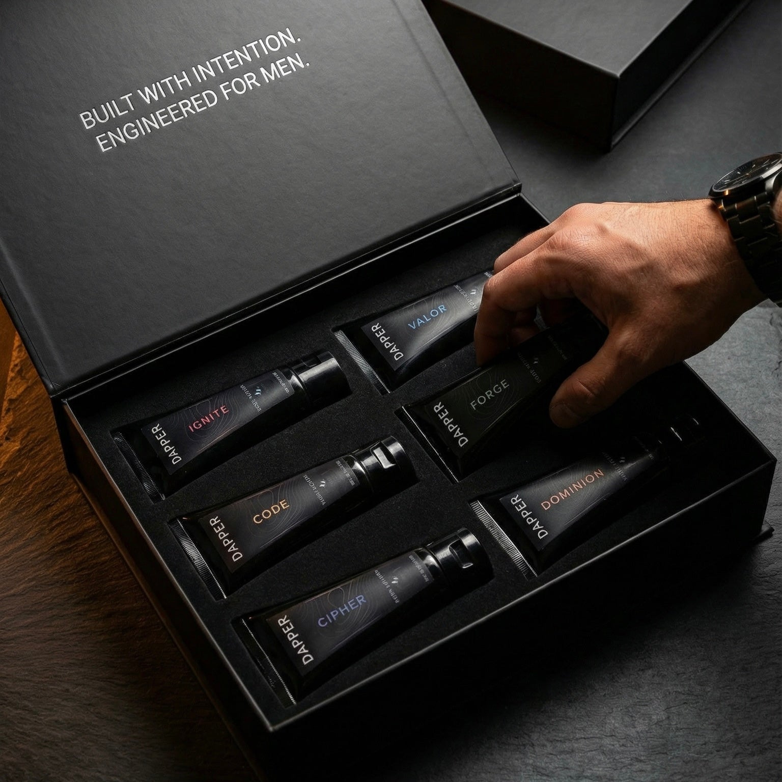 The Discovery Set - Hand reaching into open box